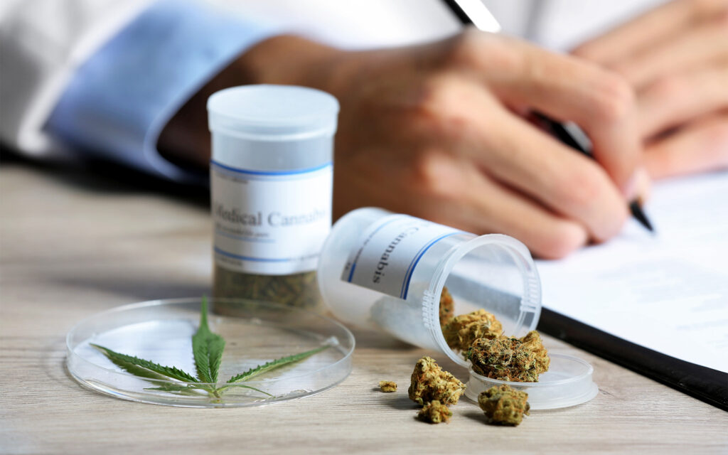 Cannabis-Leaf-in-Dish-Next-to-Clusters-in-Pill-Bottles
